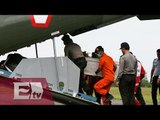 Recuperan restos de piloto del avión accidentado de AirAsia / Excélsior informa