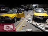 Batalla campal en Jalisco entre taxistas y comerciantes/ Vianey Esquinca