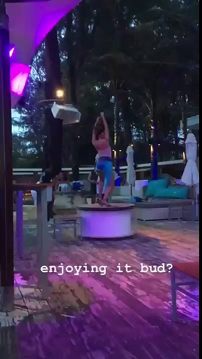 Kid laying down watching a dancer