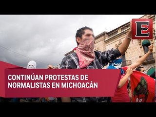 Normalistas amenazan con quemar coches y patrullas en Michoacán