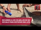 Jóvenes utilizan a un tiburón muerto para abrir una cerveza