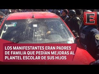 Automovilista embiste a manifestantes; lo intentan linchar