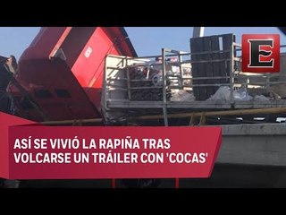Captan actos de rapiña al volcarse camión con refrescos