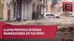 Lluvia ‘pega’ en Tultepec; derriba barda y arrastra vehículos