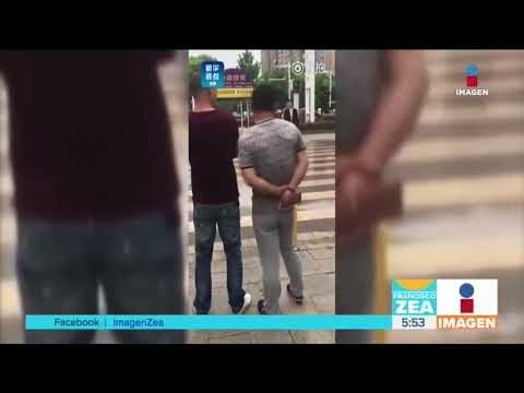 Semáforos en China lanzan agua a peatones que cruzan en rojo | Noticias con Francisco Zea