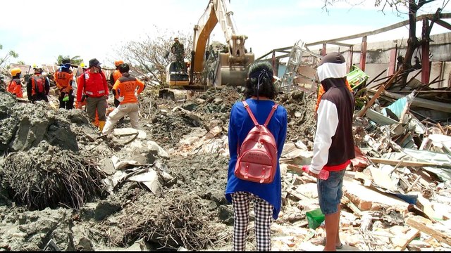 Indonesia disaster: Devastated areas may be made mass graves