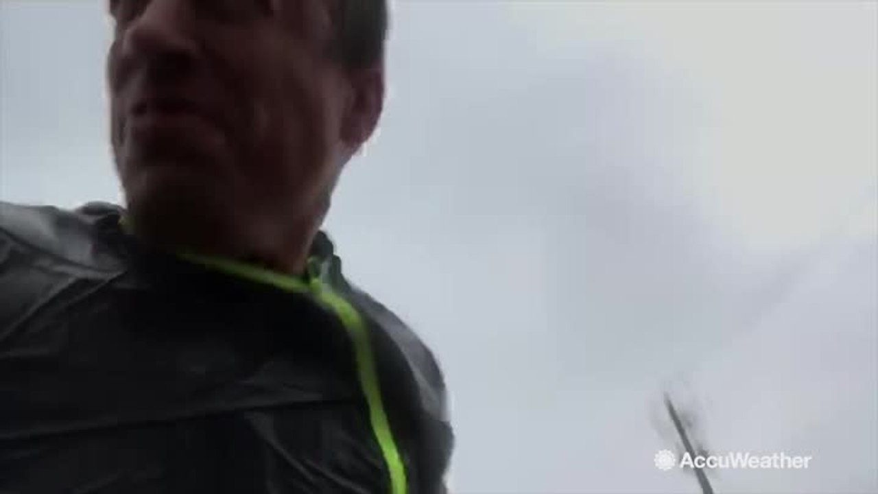 Storm chaser Reed Timmer takes cover after Michael's ferocious winds prove to be too much