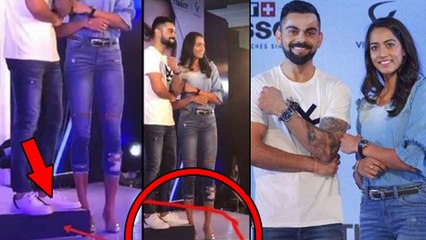 Virat Kohli Stands On A Stool Beside A Female Tennis Star