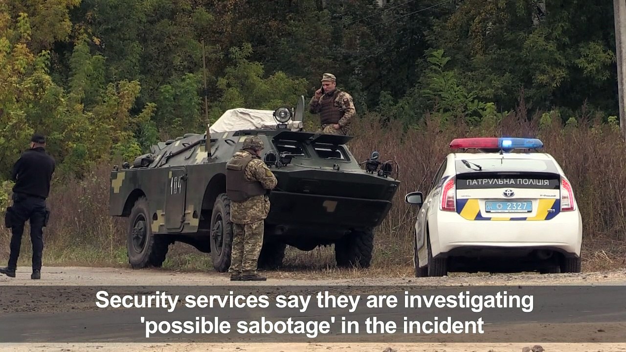 Thousands evacuated as explosions spark fire at arms depot