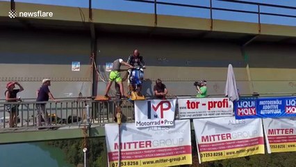 Austrian stunt rider goes bungie jumping with his faithful scooter