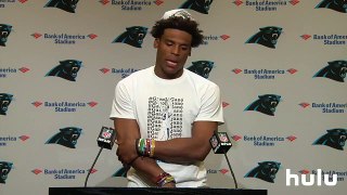 Cam Newton is at the podium