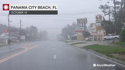 Power lines dangle over road from ferocious winds