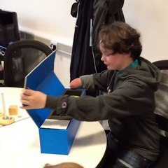 12-year-old Raimi putting on her Hero Arm for the very first time