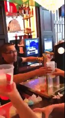 Bartender hands out free beers in the South of France