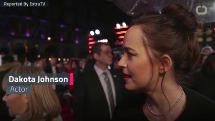 Dakota Johnson Giggles At Hemsworth