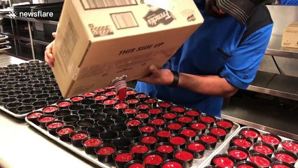 Kitchen worker fills 70 ketchup pots in a matter of seconds