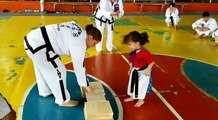 Little girl entertains the karate team!