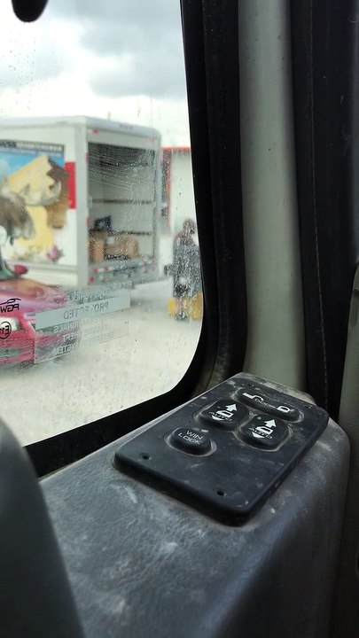 Man Carelessly Tosses Packages onto Truck