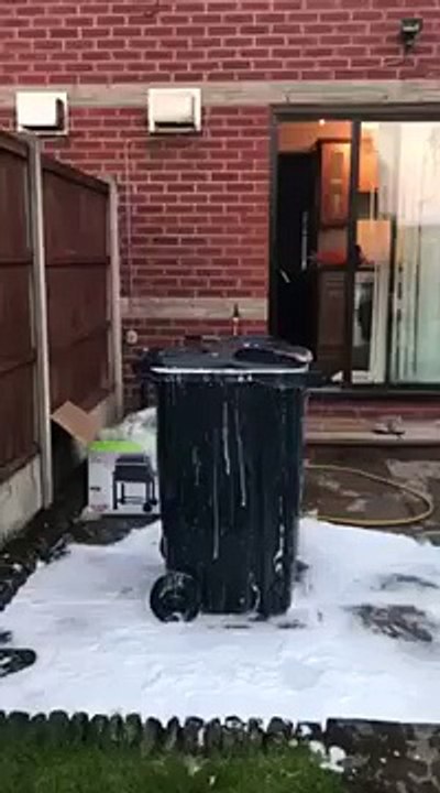 Staying cool with a beer and a bin - Lad comes out of rubbish bin filled with water - cooling off