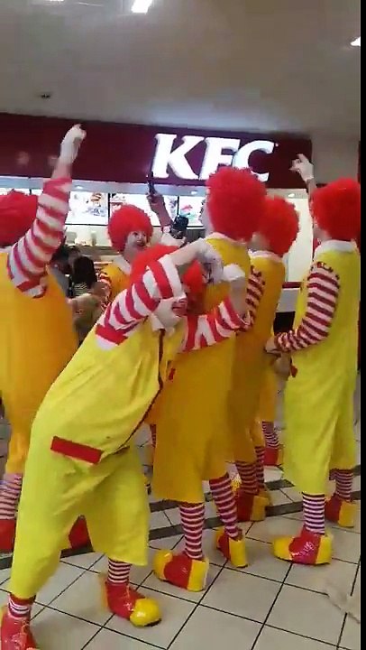 Group of Ronald McDonalds in KFC sing You're shit and you know you are