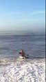 gets dumped by a wave in his kayak
