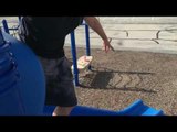 Kid Faceplants After Attempting to Ride Caster Board Down Slide