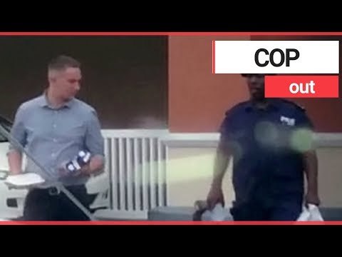 Brit cop facing rape claims spotted smiling and joking with local officers | SWNS TV