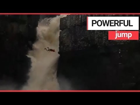 Cliff jumper nearly dies after backflipping into powerful waterfall | SWNS TV