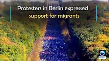 MASS RALLY IN SUPPORT OF MIGRANTS Thousands in Berlin stage protest against anti-Immigration Party, neo-Nazi groups.
