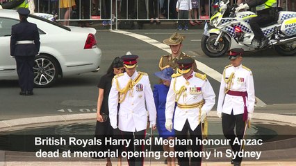Prince Harry and Meghan pay respects at ANZAC war memorial