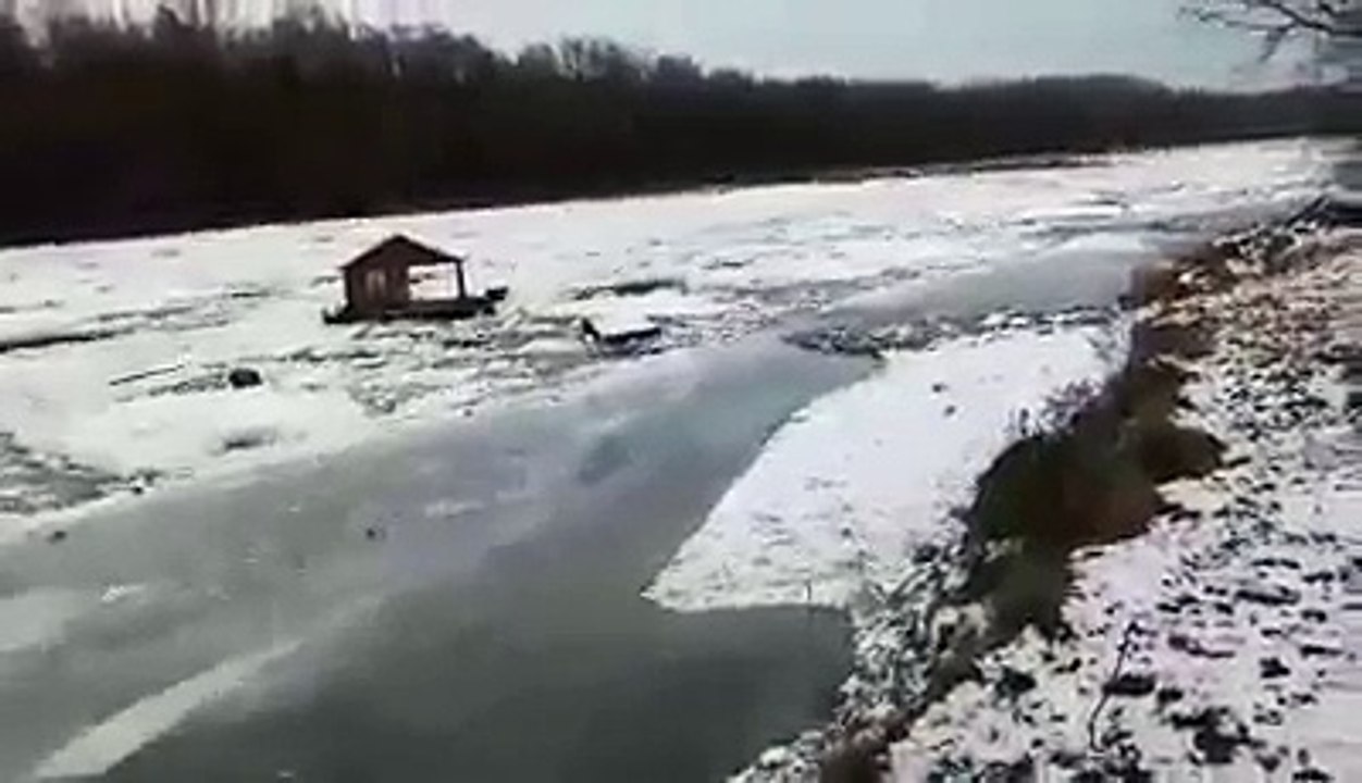 shack floats away on river