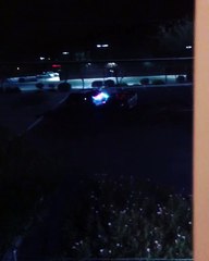 Cops Having a Lightsaber Battle in a Parking Lot