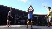 guy does the splits while jumping rope