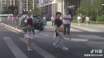 Little girl politely thanking car driver when given way