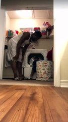 Little man helps with laundry