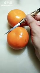 Some beautiful flowers with tangerines, cucumber and tomato