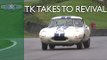 Tom Kristensen slides Jaguar E-type round soaking Goodwood