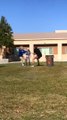 Boy Backflips to Avoid Trash Can While Playing Tug-Of-War