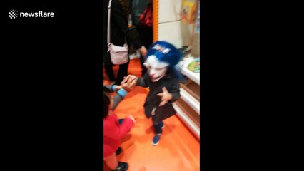 Toddler gets terrified by sight of her Halloween mask-clad older sister