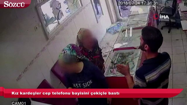 Kız kardeşler cep telefonu bayisini çekiçle bastı