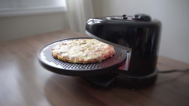 Use This Rotating Pizza Oven Because It's Smaller And Faster Than A Oven