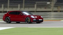 Porsche Panamera GTS Sport Turismo Night driving on the track in Carmine Red