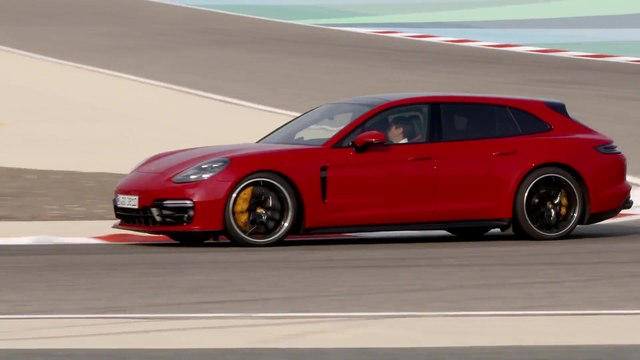 Porsche Panamera GTS Sport Turismo Driving on the track in Carmine Red