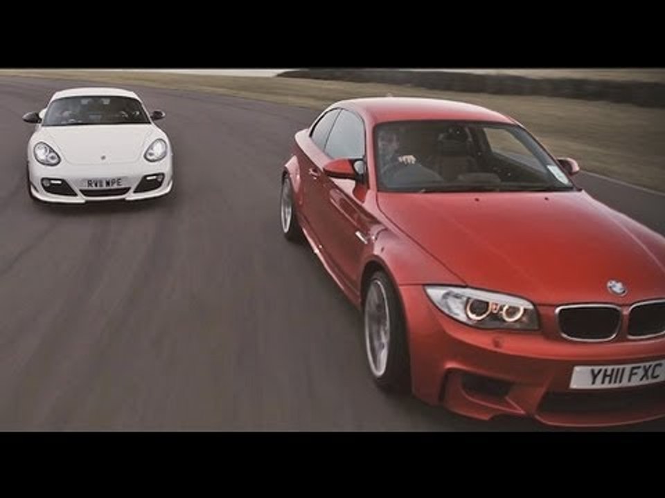 Porsche Cayman R and BMW 1-series M Coupe drifting sideways