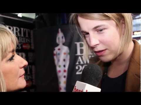 Critic's Choice winner Tom Odell talks to heat at the Brits 2013 red carpet