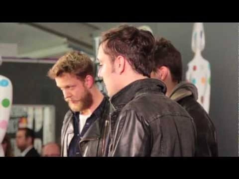 Mumford & Sons drunk at the Brit Awards 2013 Winner's Conference hugging giant statues