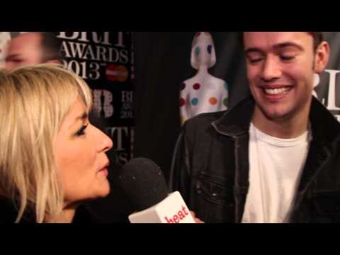 Mumford & Sons' Ben Lovett and Winston Marshall talk to heat on the Brits 2013 red carpet