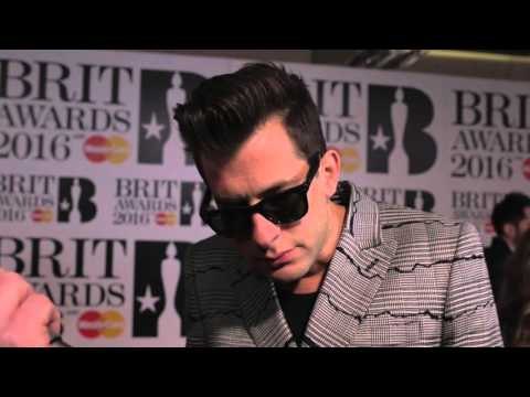 Mark Ronson on the Brits 2016 red carpet with James Barr