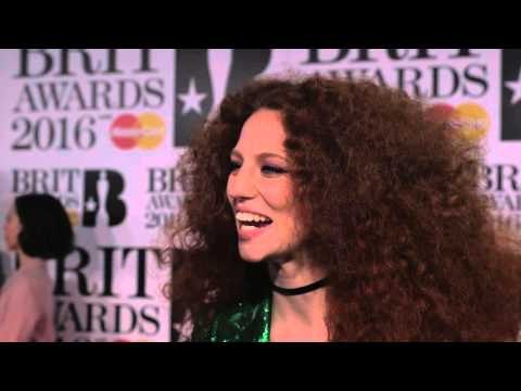 Jess Glynne on the Brits 2016 red carpet with James Barr