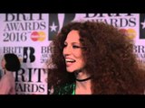 Jess Glynne on the Brits 2016 red carpet with James Barr